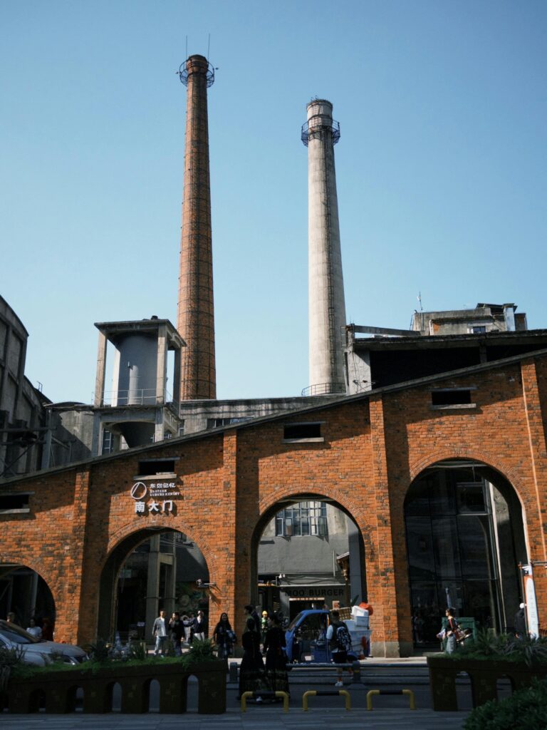 Explore the iconic industrial structures in Chengdu, showcasing tall smokestacks and brickwork.
